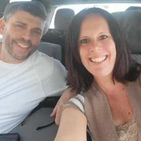 Smiling couple in car selfie